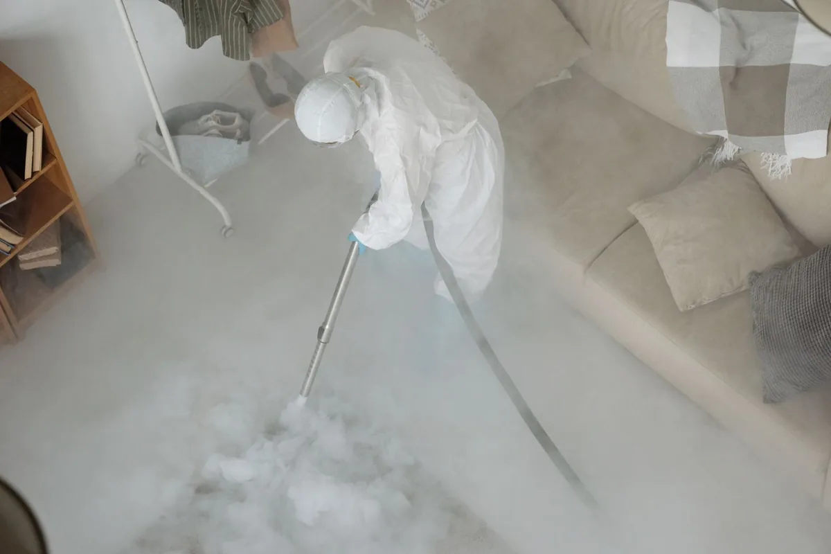 Biohazard cleanup technician in protective equipment, Belle, WV